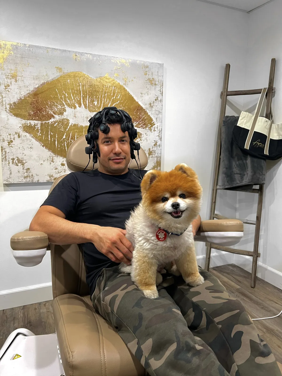 Patient relaxing with a therapy dog during a session at Neuron Connect